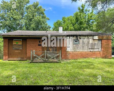 Dilapidated house with boarded-up doors and windows in the South Suburbs of Chicago, IL USA Stock Photo
