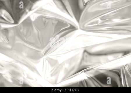 Close-up of silver foil texture with reflective metallic abstract surface and shiny folds Stock Photo