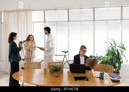 Diverse startup team collaborating at modern office Stock Photo