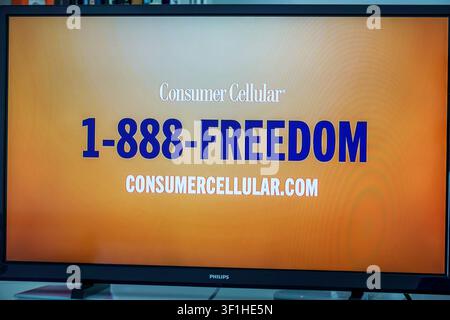 Miami Beach Florida,tv television,screen monitor,commercial ad advertisement,Consumer Cellular,1-888-FREEDOM,ConsumerCellular.com,wireless service,mob Stock Photo