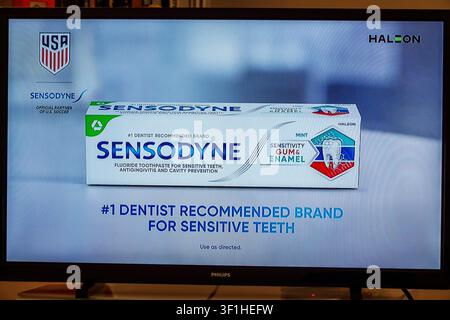Miami Beach Florida,tv television,screen monitor,commercial ad advertisement,Sensodyne,Haleon,U.S. Soccer,official partner,sensitive teeth,toothpaste, Stock Photo