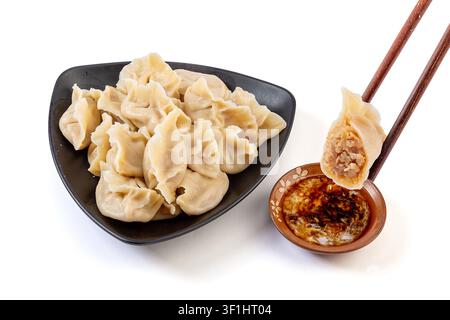 Winter Melon and Pork Dumplings on White Background with Dipping Sauce Stock Photo