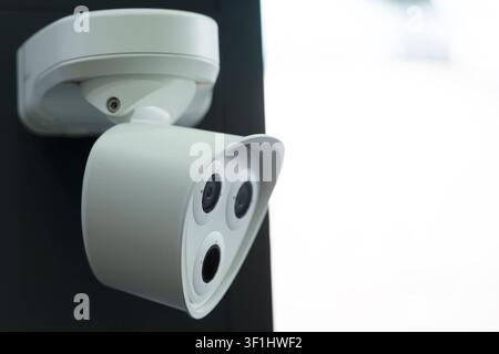 Close-up of a modern CCTV security camera installed for professional video surveillance. Advanced smart monitoring solution featuring high-resolution Stock Photo