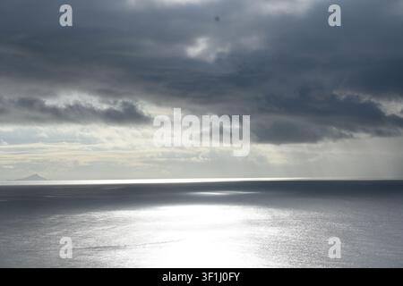 Sunbeams Breaking Through Storm Clouds Over the Pacific Ocean, San Carlos, Panama Stock Photo