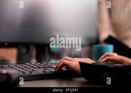 App developer types machine learning code on a computer while checking an artificial intelligence project and database script in a software office. Stock Photo
