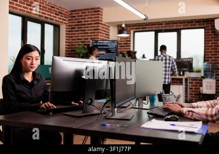 Tech enginners programming server code algorithm on computer, typing sever data in it agency office. Software developer working on new user interface with online system to create algorithm. Stock Photo