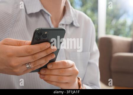 Person holding a modern smartphone with multiple cameras, digital communication and mobile technology Stock Photo