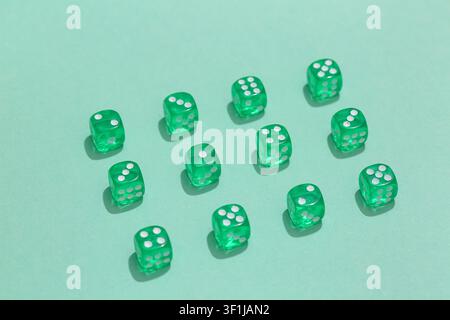 Green game dices on turquoise background Stock Photo
