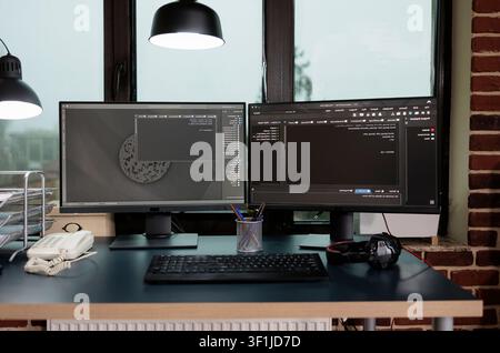 Empty office filled with programming displays presents a row-specific commercial moment, presenting Christmas celebration, pet companionship and family warmth in a modern software workspace. Stock Photo