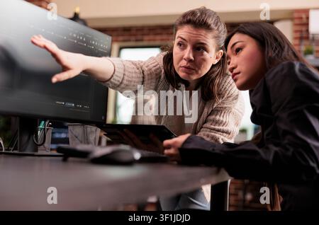 Engineers analyzing HTML code for AI project featuring planning artificial intelligence project, Web developers working on machine learning software. Stock Photo