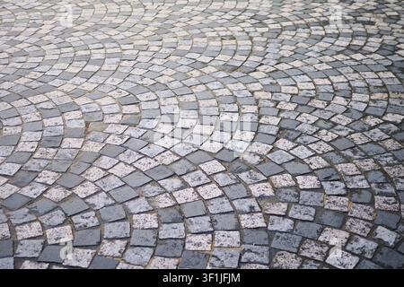 Pattern of stone tiles on a walkway in the city Stock Photo