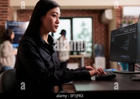 Cyber officer encrypts large data files to protect company information with autonomous defense and artificial intelligence technology. Stock Photo