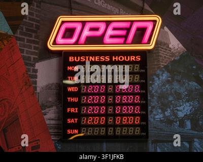 Illuminated neon open sign attached to an electronic ledger displaying digital weekly business hours hanging against a decorated wall Stock Photo