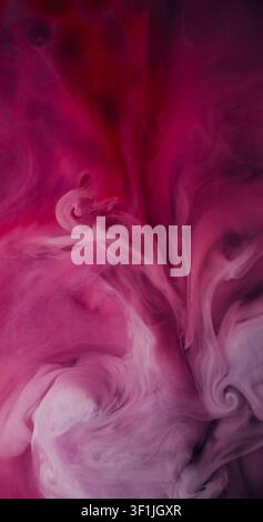 Magic steam. Paint shot. White pigment spray burst in purple red watercolor liquid. Art haze color blend abstract defocused background. Stock Photo