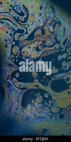 Spectrum soap. Psychedelic dye flow. Iridescent paint liquid chaotic defocused texture. Mix bubble blob water emulsion abstract background. Stock Photo