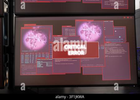 Closeup of desktop monitor displaying critical system error messages and warning alerts. Vacant office with computer screen showing malfunction alerts, symbolizing technical issues and IT disruption. Stock Photo