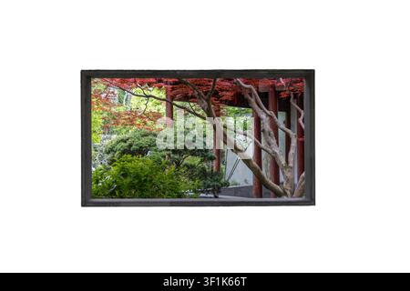 Details of Chinese classic garten architecture art - a rectangular shape window frame on the wall to revail the garten plants and rocks to add more de Stock Photo