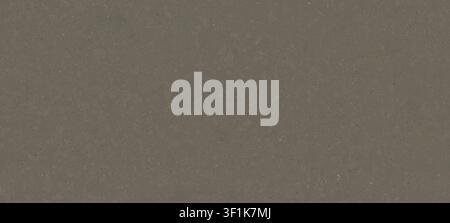 A full-frame background of an engineered taupe grey quartz stone surface featuring a matte texture with very fine speckles. Stock Photo