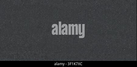 A dark grey granite or concrete texture featuring tiny light-colored mineral speckles distributed evenly across the textured surface. Stock Photo