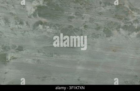 Natural green quartzite stone surface with fine white veining patterns. Stock Photo