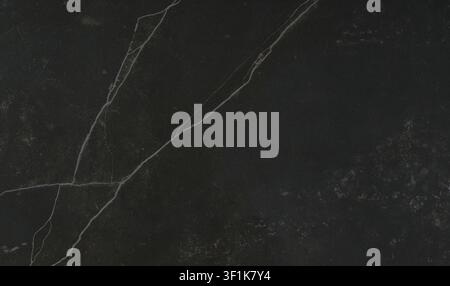Elegant black marble surface with striking white diagonal veins. Stock Photo