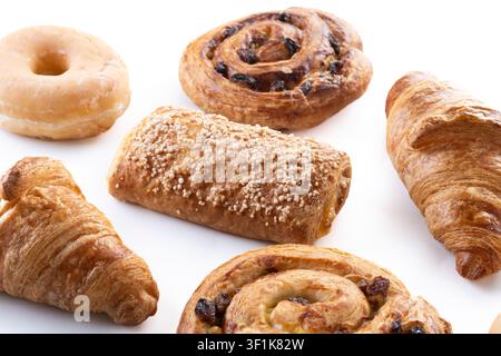 Assorted breakfast pastries isolated on a white background Stock Photo