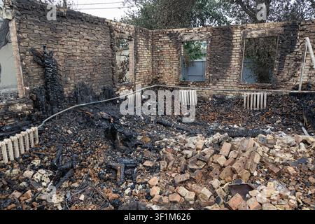 Vyshneve, Kyiv Region, Ukraine – July 6, 2026 Interior of a destroyed residential house after a large-scale attack. Only brick walls, empty window ope Stock Photo