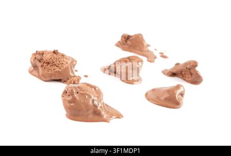 Melted chocolate ice cream isolated, real melting cocoa icecream drops, chocolate ice stain puddle on white background Stock Photo
