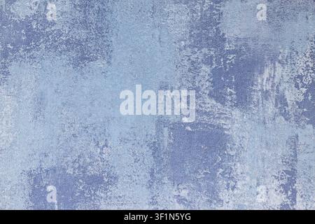Blue textured wallcovering background with distressed plaster effect Stock Photo