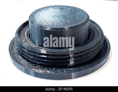 3D printed part from black plastic on 3D printer. Object printed on 3D printer from molten plastic isolated on white background. FDM Fused Deposition Modeling technology. Additive modern manufacturing Stock Photo
