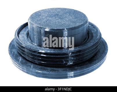 3D printed part from black plastic on 3D printer. Object printed on 3D printer from molten plastic isolated on white background. FDM Fused Deposition Modeling technology. Additive modern manufacturing Stock Photo