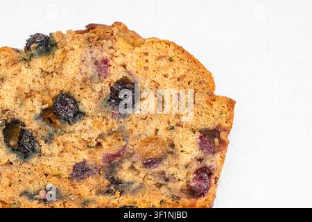 Looking into a Slice of Blueberry Zucchini Bread on a White Background Stock Photo