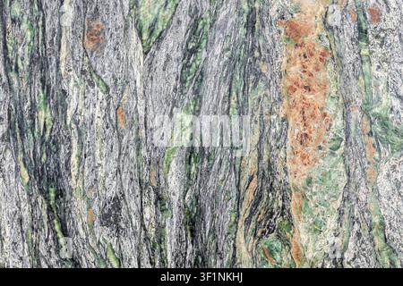 Natural marble surface gray green tone organic layer mineral pattern abstract background detail rugged structure. Textured stone slab elegant Stock Photo