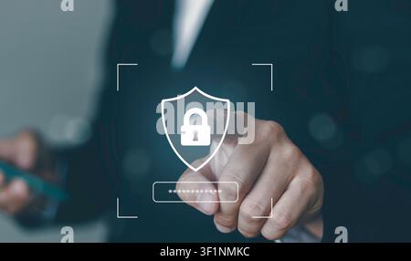 Close up businessman pointing at digital shield padlock and password bar icon. Cybersecurity authentication, secure login access, and data privacy pro Stock Photo