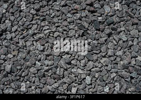 Gray crushed granite stone texture background with natural gravel surface full frames Stock Photo