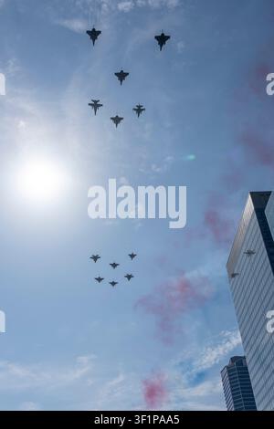 Paris, France - 07 14 2026: Air show of July 14. 12 Rafale Military planes flying above the district of La Defense Stock Photo