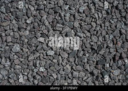 Gray crushed granite stone texture background with natural gravel surface full frames Stock Photo
