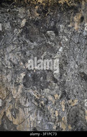Dark weathered plaster wall texture with distressed aged surface backgrounds Stock Photo