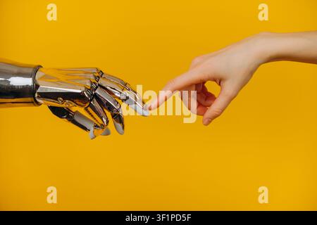 Human hand and a robot hand touching fingers, symbolizing interaction, collaboration, and the evolving relationship between humanity and advanced artificial intelligence and technological progress Stock Photo