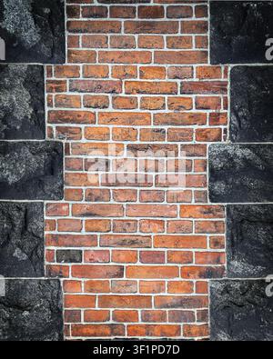 Old Red Brick and Dark Stone Wall Texture Background Stock Photo