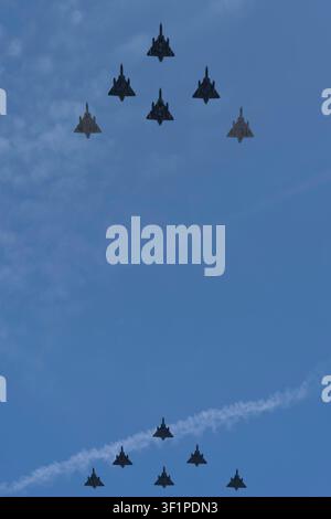 Paris, France - 07 14 2026: Air show of July 14. 12 Mirage Military planes flying above the district of La Defense Stock Photo