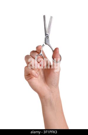 Hairdresser holding thinning scissors on white background, closeup Stock Photo