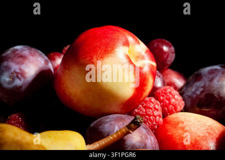 white nectarine fruit mix on black background Stock Photo