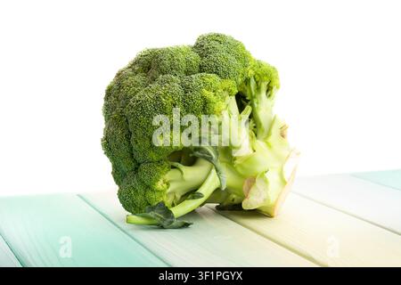 broccoli on wood background on white Stock Photo