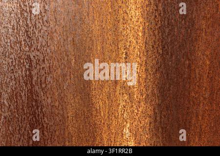 Rusted metal sheet texture background, close up of weathered orange rust spots and corrosion runs on metallic surface, detailed full frame oxidized Stock Photo