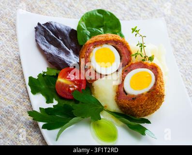 Scotch eggs with vegetables Stock Photo