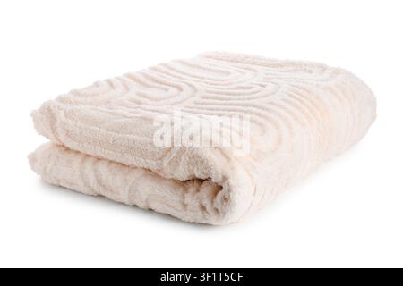 Folded soft beige plush blanket with embossed swirl pattern, cozy home textile for comfort and warmth, this cozy home textile is ideal for bedding or Stock Photo