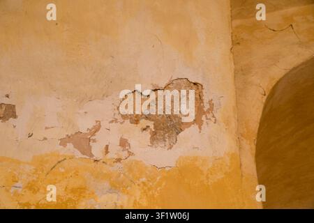 Weathered Plaster Wall Texture in Historic Fortress Interiors Stock Photo