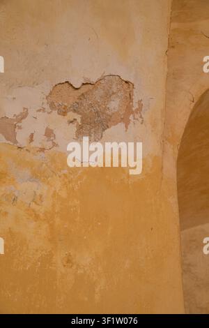 Aged Cracked Stucco Wall with Rustic Architectural Textures Stock Photo