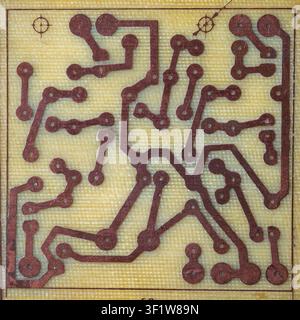 Background with printed circuit board. Printed radio electronic board, top view. The concept of radio electronics. PCB without microchips. Development Stock Photo